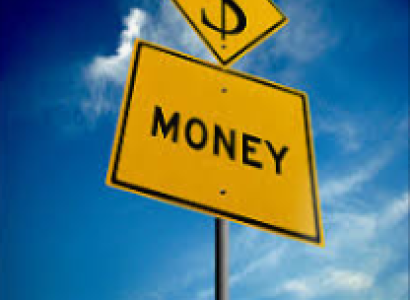 Two yellow street signs on a post against a blue sky one says MONEY and one is a money symbol