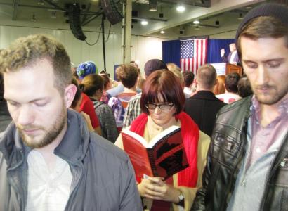 Kyle Landis, Hayley Cotter, and Jordan Patton catch up on their reading while Donald Trump speaks at the Greater Columbus Convention Center.