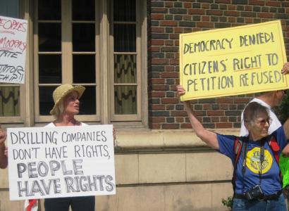 Two women holding protest signs