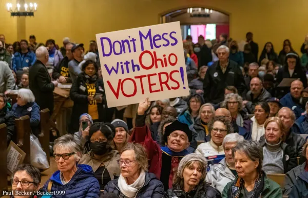 People protesting with sign saying Don't Mess with Ohio Voters