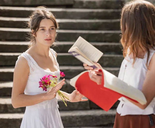 Young woman interacting with another young woman