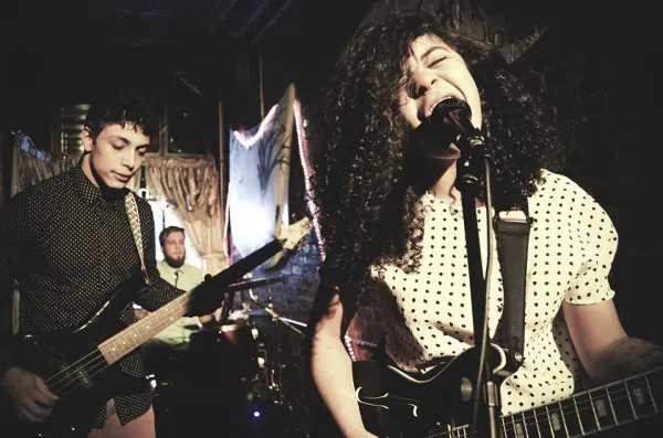 Woman singing and guy on guitar