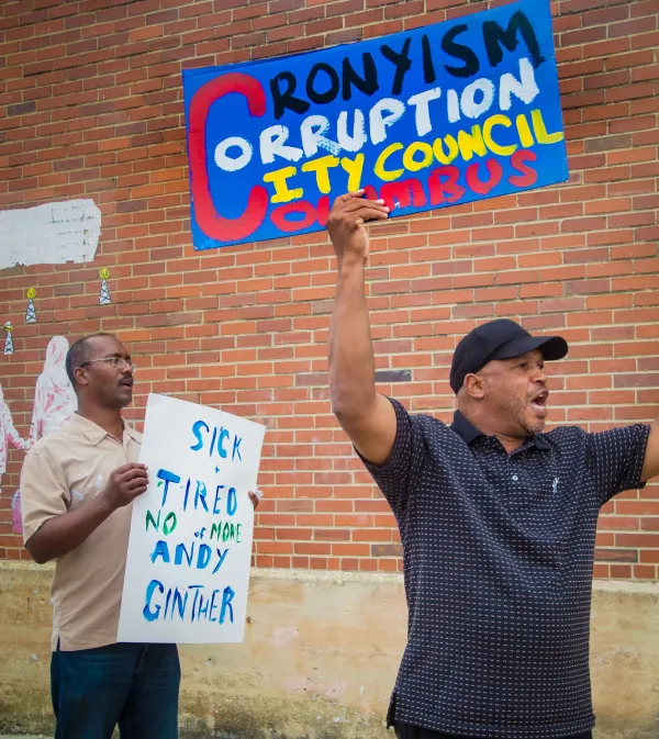 Man with protest sign