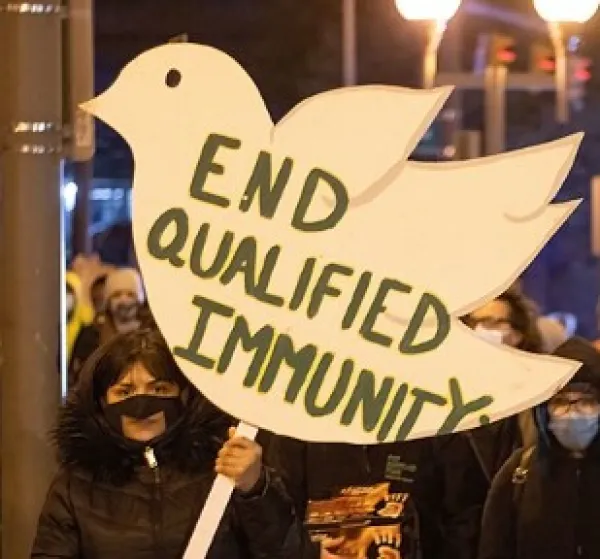 Sign at protest sayind End Qualified Immunity