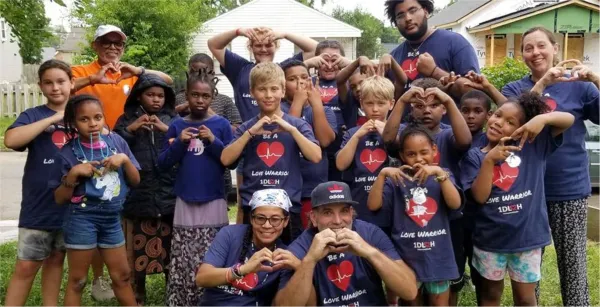Kids making heart signs with their hands