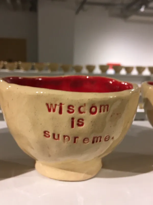 Coffee mug that says Wisdom is something