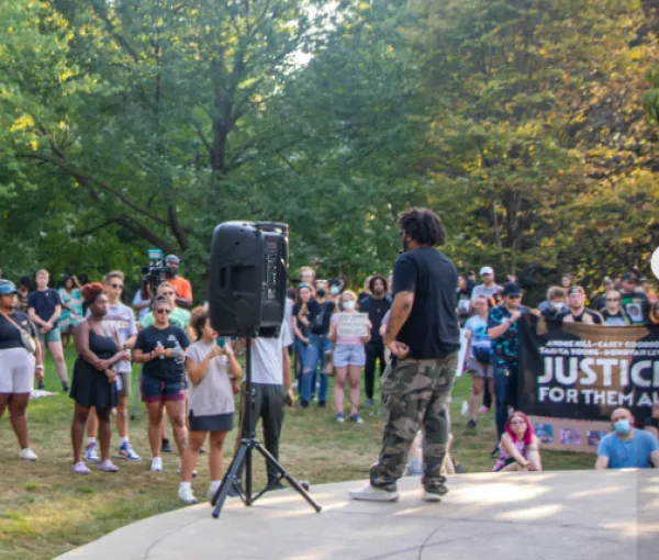 Speakers and crowd by gazebo