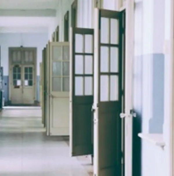 Hallway with lots of doors open