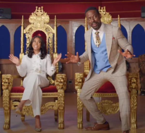 Black preacher and wife in big thrones