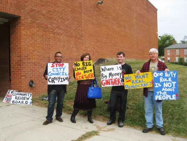 Protesters outside the October 1 public meeting asked: Where is Andrew Ginther?