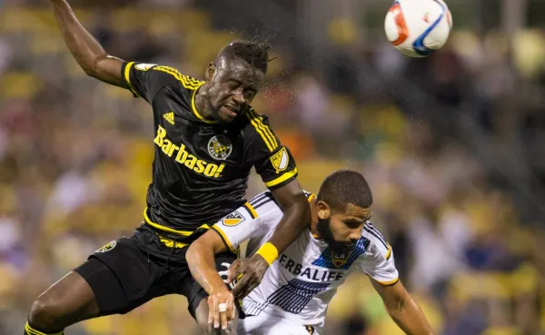 Kei Kamara (left) battles for a header against LA Galaxy defender Leonardo. (Photo courtesy of Crew SC)