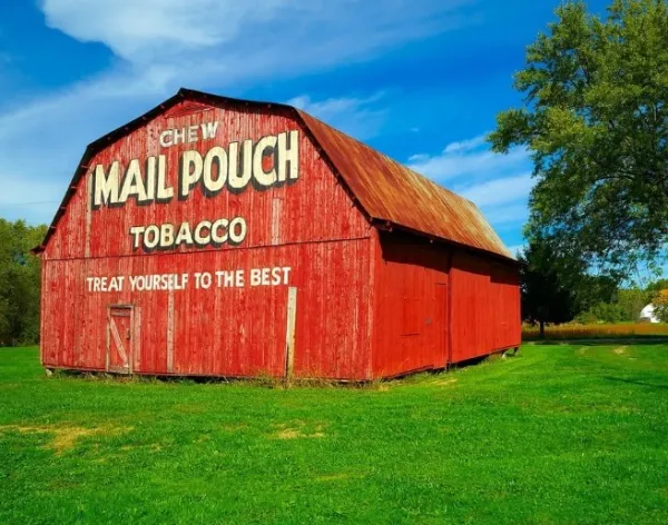 Red barn with Mailpouch written on it