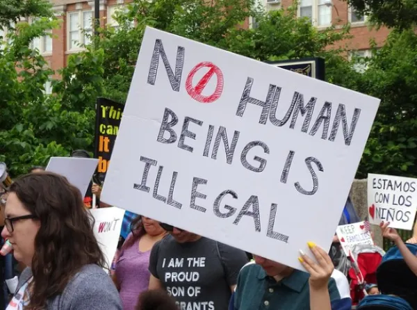 No Human Being is Illegal sign