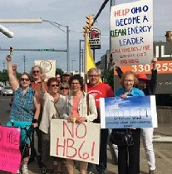 Lots of white people outside with signs against HB6
