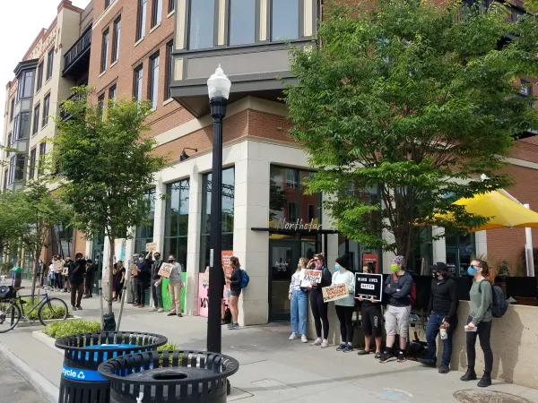 People protesting outside a building