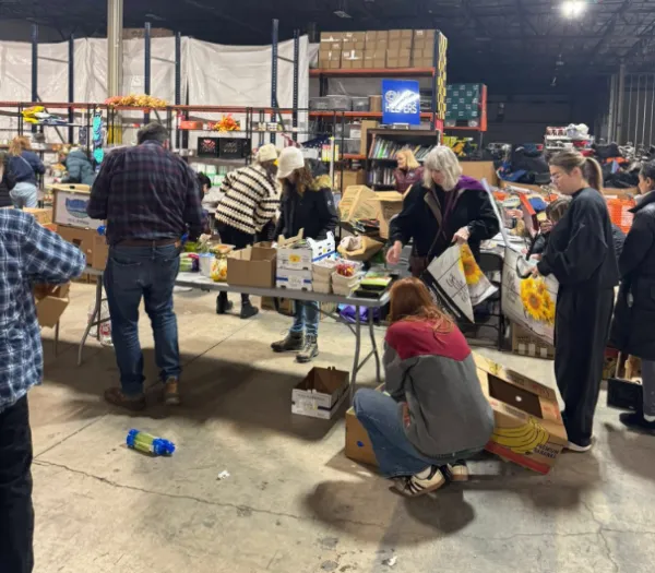 People in a food warehouse packing