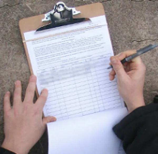 Someone signing a petition