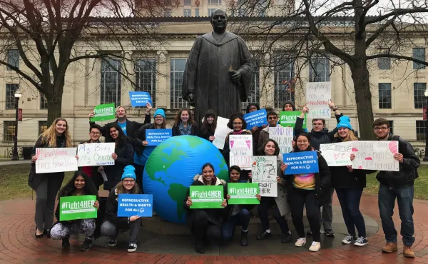 SDD demonstrators next to the Columbus statue at City Hall