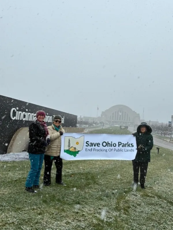 People holding Save Ohio Parks banner