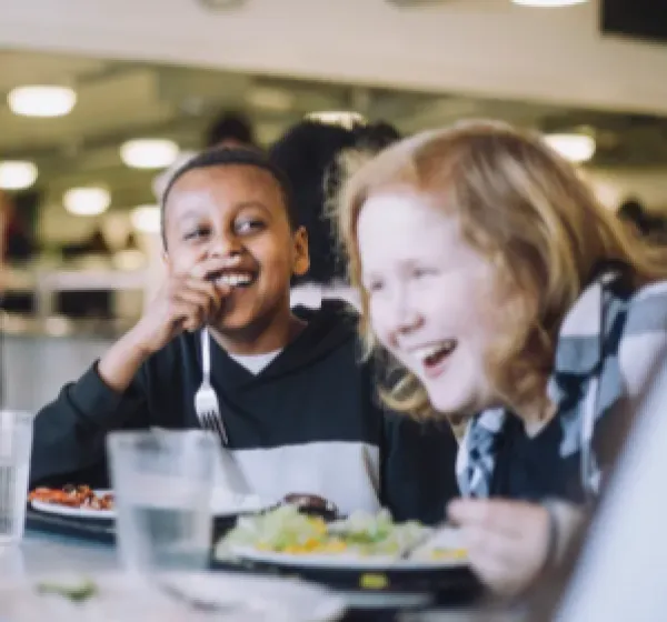 Children at table eating lunch
