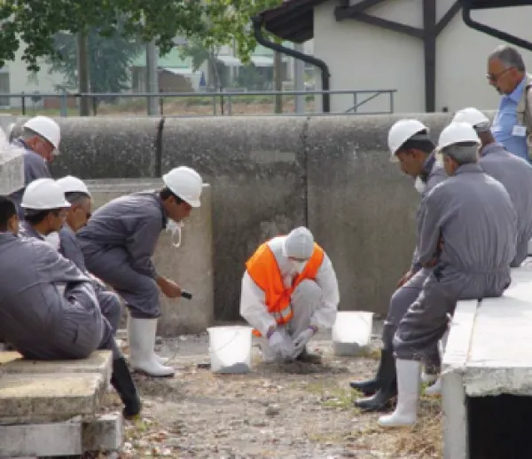 Men in hazard suits working