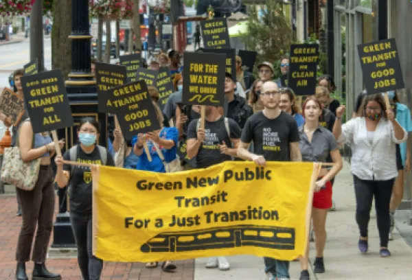 People with banners and signs