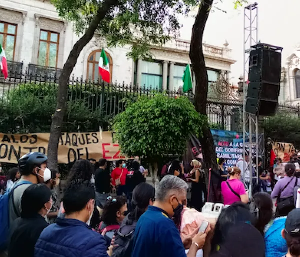 Reporters and buildings with flags
