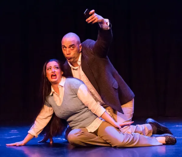 Man and woman on the floor taking a selfie