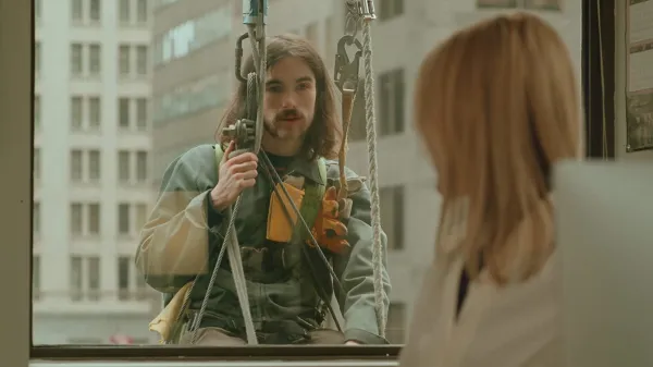 Window washer outside a window