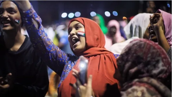 Woman shouting in a crowd