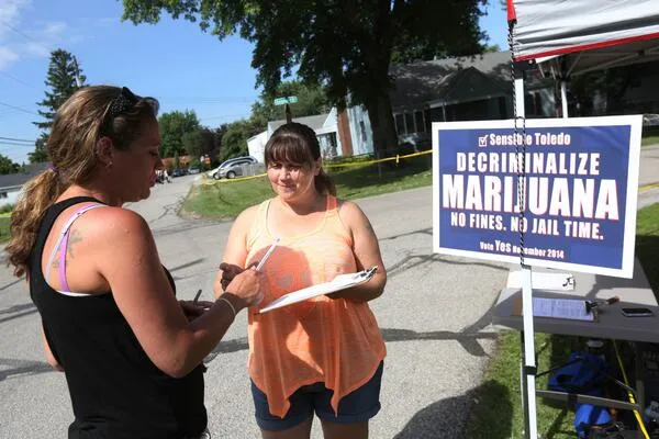 Photo of people with political sign