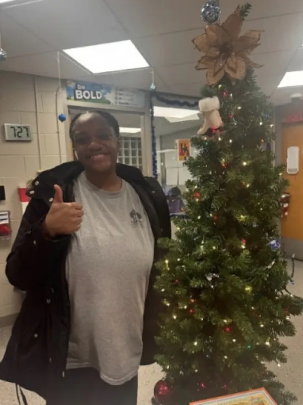 Woman by a Xmas tree