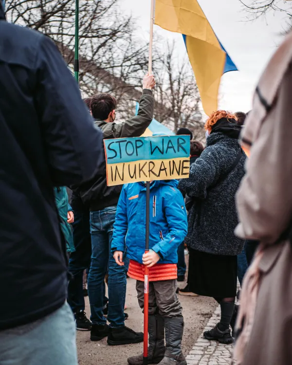 Child with sign Stop War in Ukraine