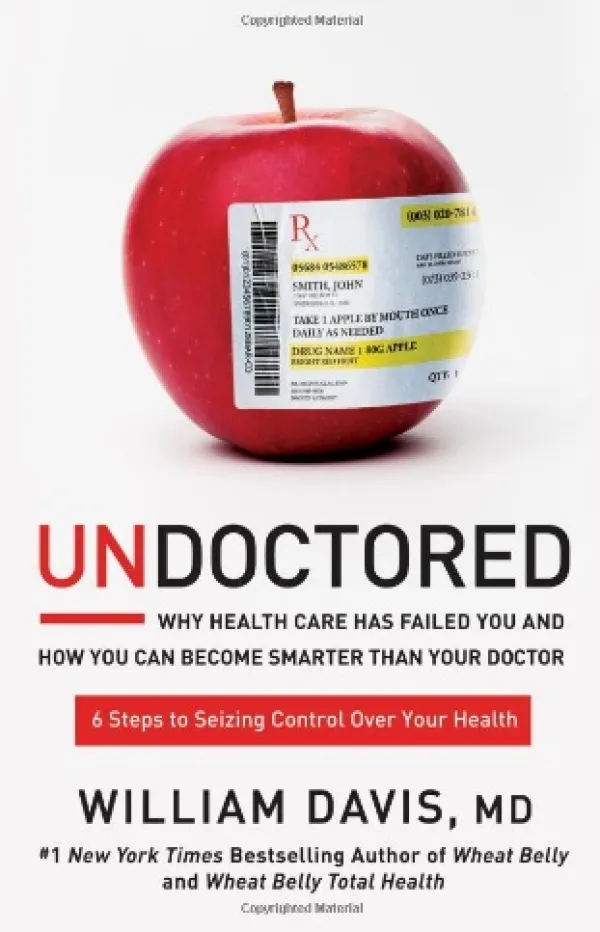 Cover of Undoctored book, with an apple with a prescription pasted on it