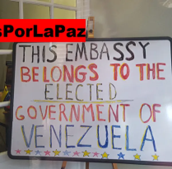 A sign saying This embassy belongs to the elected government of Venezuela