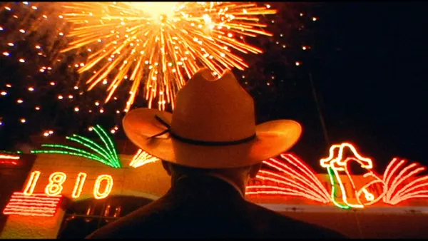 Fireworks and a guy in cowboy hat