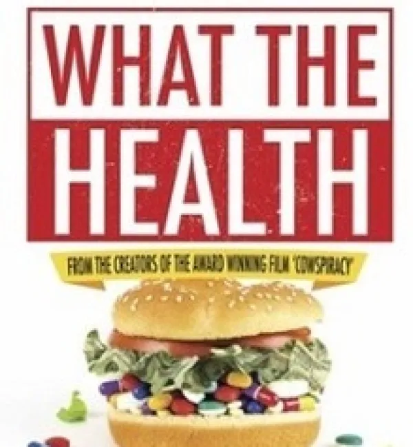 Big hamburger with pills between buns and words What The Health