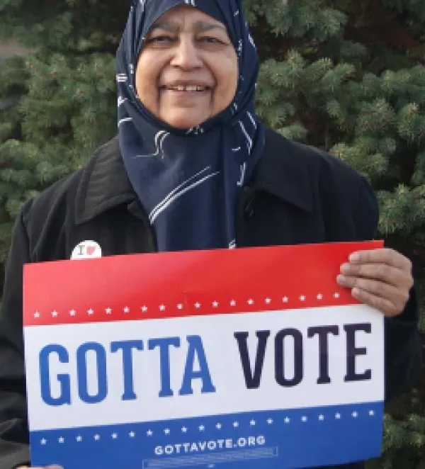 Zerqa holding sign
