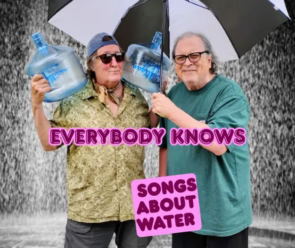 Bob and Dan with an umbrella and water bottles