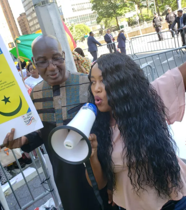 Woman yelling into a mega phone