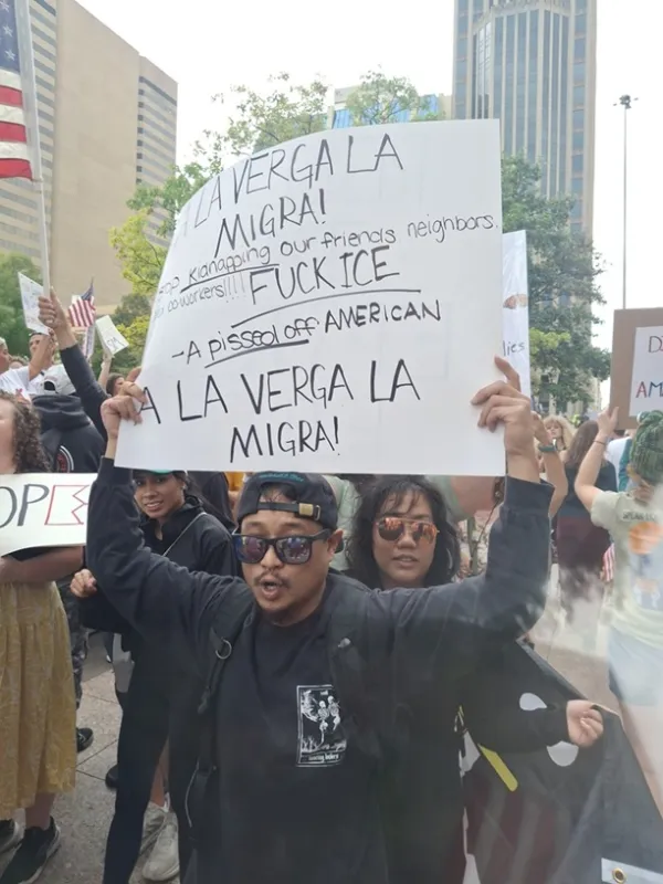 Man holding protest sign